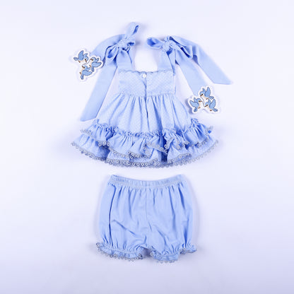 Back view of Cinderella inspired hand smocked blue ruffle top and bloomer two-piece outfit for toddlers.