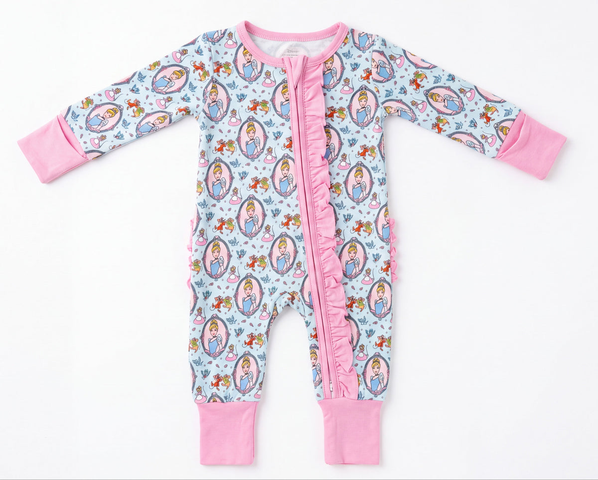 Cindy and Mouse bamboo two-way zip sleeper in light blue with princess portrait print and pink trim.