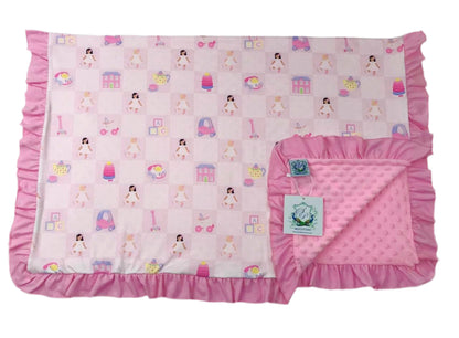 Dolly and Me exclusive print baby blanket featuring a pink doll toy pattern, ruffle trim, and soft minky backing.