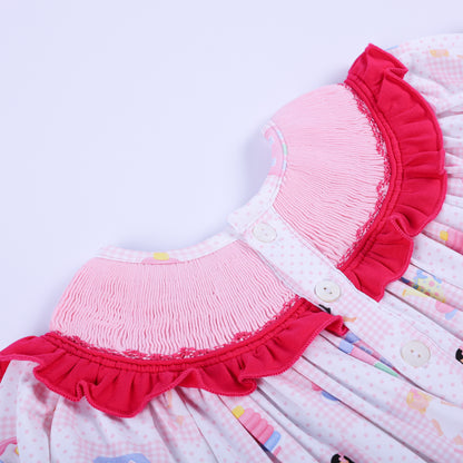 Angled detail of the button closure and pleated smocked collar on Dolly & Me pink vintage toys bubble infant romper.