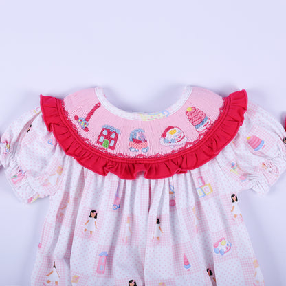 Close-up of the embroidered vintage toy collar on the Dolly & Me pink hand-smocked bubble romper for babies.