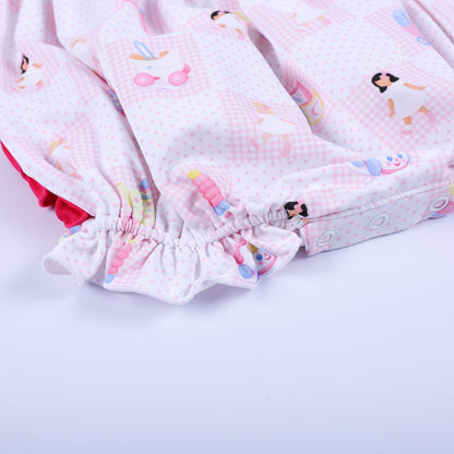 Close-up of the bottom diaper snaps and elastic ruffle leg opening on Dolly & Me pink checkered bubble romper.
