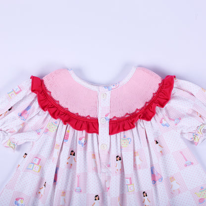 Detailed view of the button back closure and hand smocked ruffle neckline on Dolly & Me vintage toys tunic top.