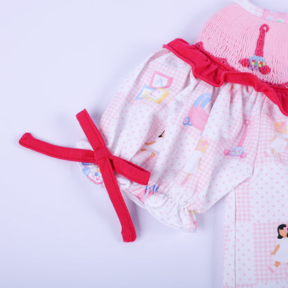Detailed close up of a puff sleeve with a dark pink bow tie on the Dolly & Me vintage toys checkerboard tunic top.
