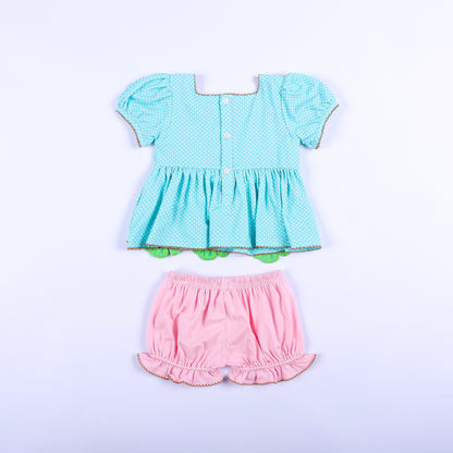 Full back view of aqua polka dot button-back shirt and pink ruffled bloomers set for kids smocked outfit.