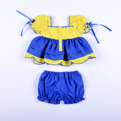 Back view of girls Belle and Beast set showing yellow button closure back top and blue elastic waistband bloomers.