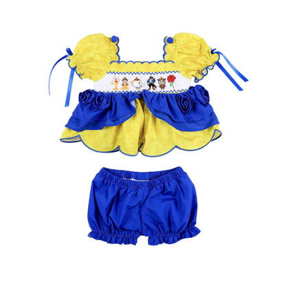 Girls yellow and blue smocked bloomer set featuring hand-embroidered fairytale character top and matching shorts.