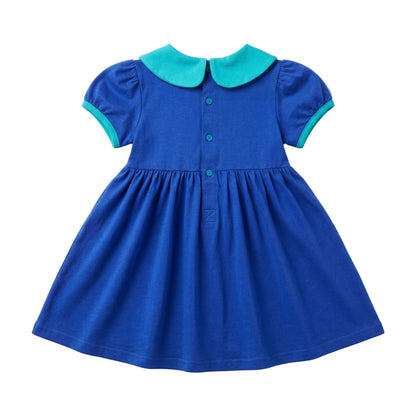 Back view of girls royal blue short-sleeve dress with a teal collar and button closure.