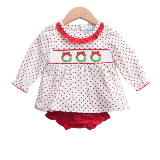 Girls white smocked Christmas wreath bloomer set featuring red polka dots and matching red bottoms.