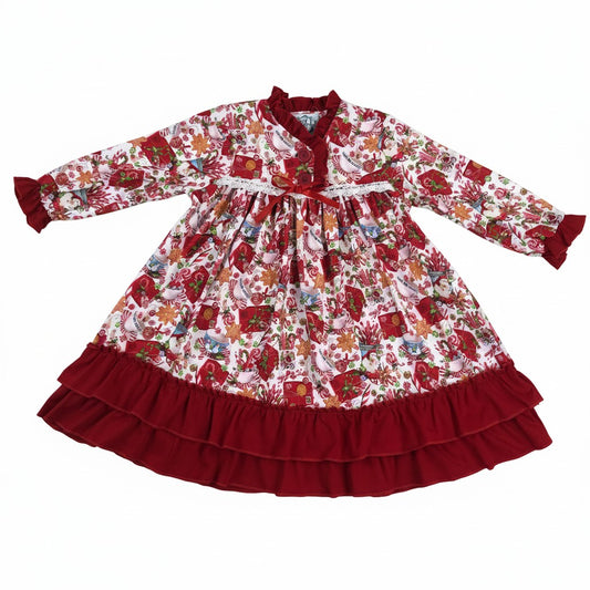 Girls holiday dress with candy cane and gingerbread print, red ruffle hem, and lace trim.
