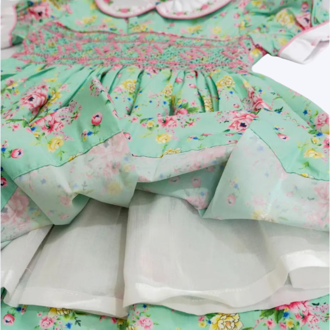 Soft white breathable inner skirt lining on girls mint green floral smocked dress