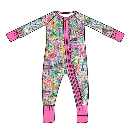 Watercolor New Orleans print baby sleeper with pink zipper ruffle, cuffs, and neckline.