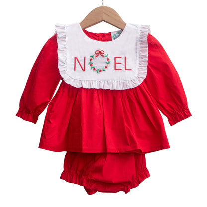 Girls red Christmas bloomer set with white bib, ruffle trim, and embroidered NOEL wreath. 2 piece outfit.