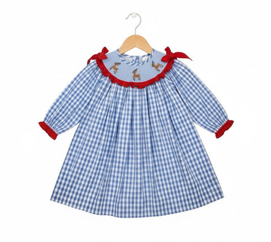 Girls blue gingham dress with hand smocking featuring reindeer and red ruffle trim on collar and cuffs.
