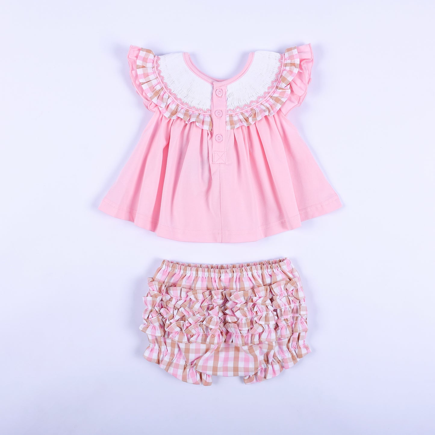 Back view of pink baby smocked top with buttons and matching ruffle back gingham diaper cover bloomer set.