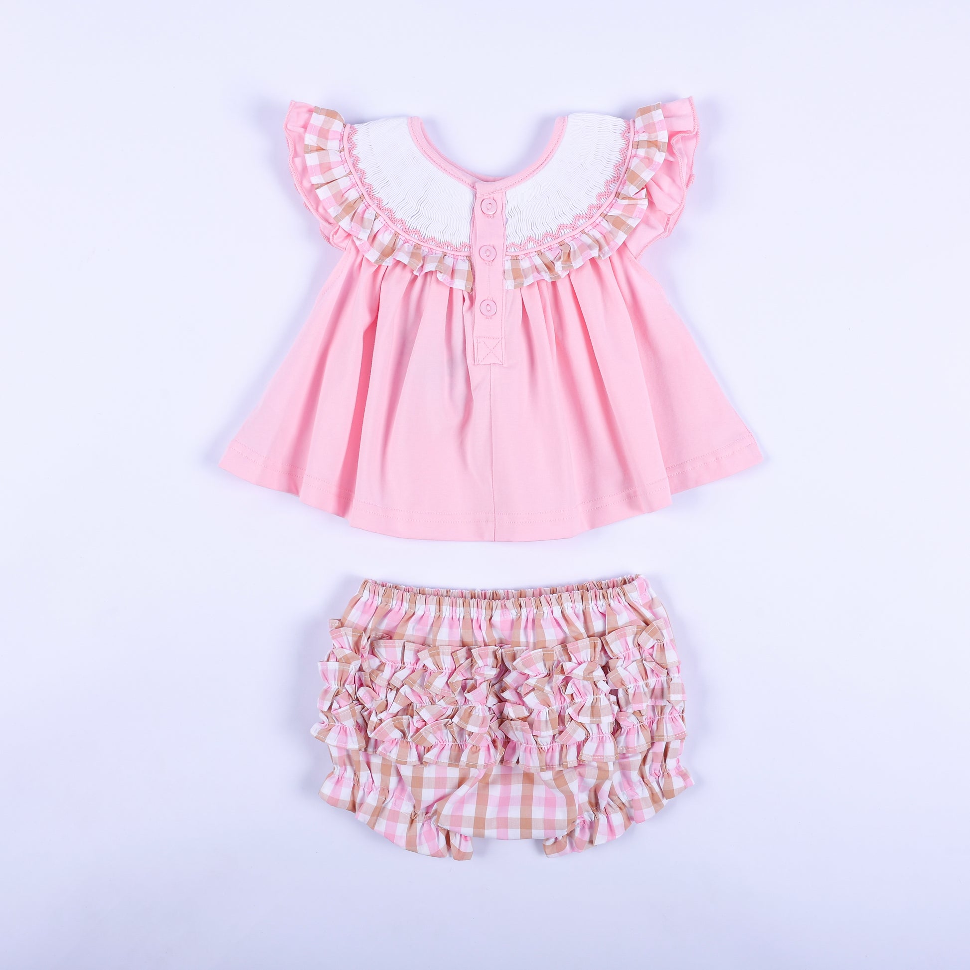 Back view of pink baby smocked top with buttons and matching ruffle back gingham diaper cover bloomer set.