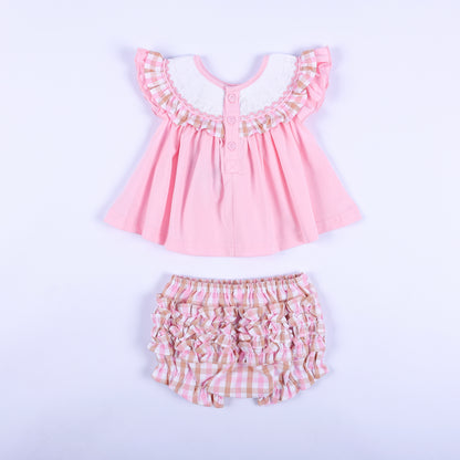 Back view of pink baby smocked top with buttons and matching ruffle back gingham diaper cover bloomer set.