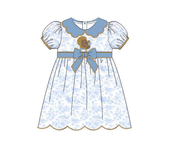 Grandmillenial blue toile dress for girls with turkey embroidery and scalloped hem.