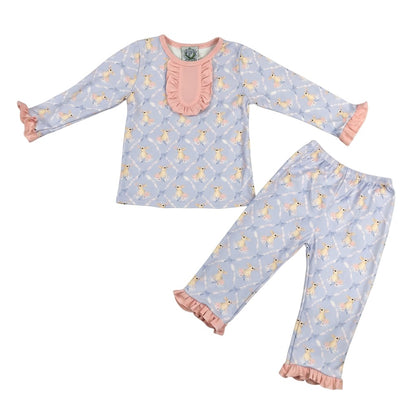 Two-piece Grandmillennial Easter Bunny girl pajama set with pink ruffle trim on a clean white background.