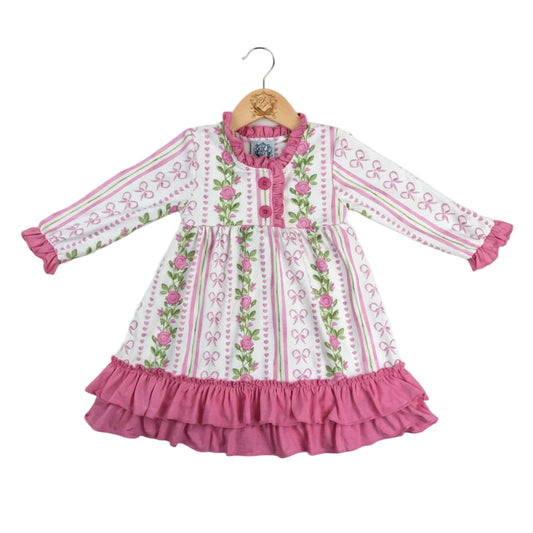 Grandmillennial floral pink hearts girl nightgown on a wooden hanger with pink ruffle hem trim and long sleeves.