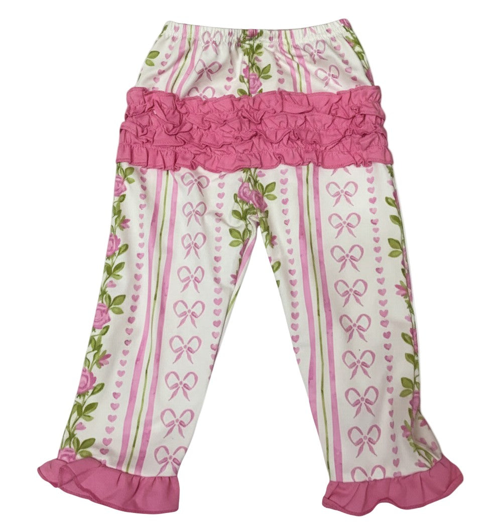 Grandmillennial floral pink hearts pajama pants featuring cute ruffled seat detail and matching pink ruffled cuffs.