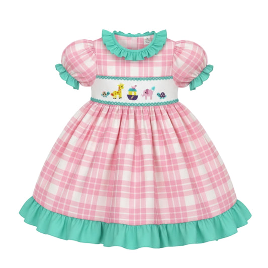 Pink plaid hand-smocked dress with Noah's Ark embroidery and teal ruffle trim.