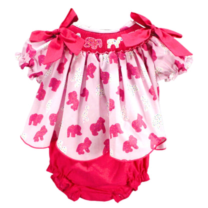 Hand smocked frosted sprinkle animal cookies set featuring a pink printed top with shoulder bows and matching bloomers.