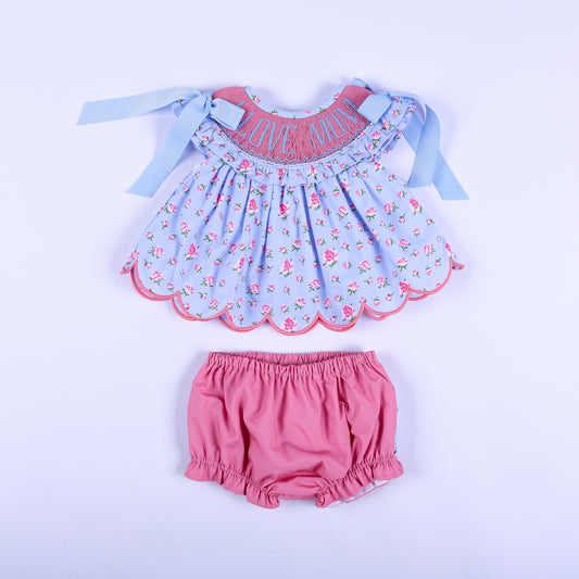 I Love Mom floral hand-smocked top and matching pink diaper cover bloomer set for baby girls, front view.