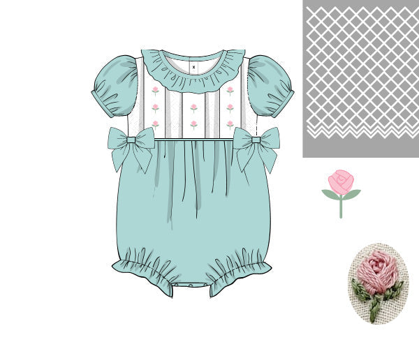 Mint and ivory girls bubble romper featuring hand-smocked pink flowers on a trellis pattern with side bows.