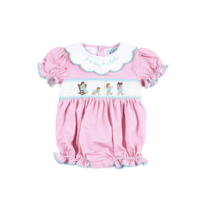 Front view of Just Stay This Little hand smocked baby girl bubble romper with embroidered milestones and collar.