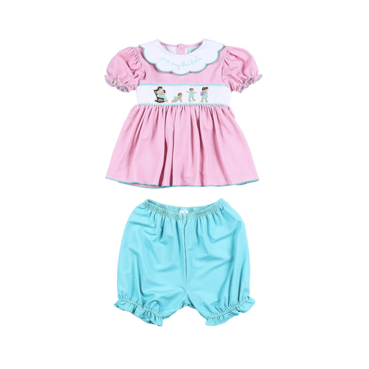 Hand-smocked pink dress and turquoise bloomer set for baby girls featuring scalloped collar embroidery.