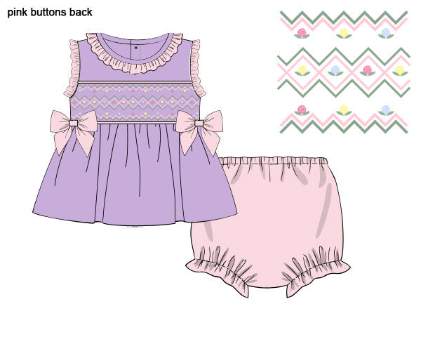 Lavender and baby pink hand-smocked girls top and bloomer set with flower embroidery and side bows.