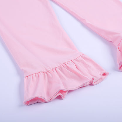 Close-up detail of the soft custom knit light pink ruffle-hem pants from the girls boutique Thanksgiving set.