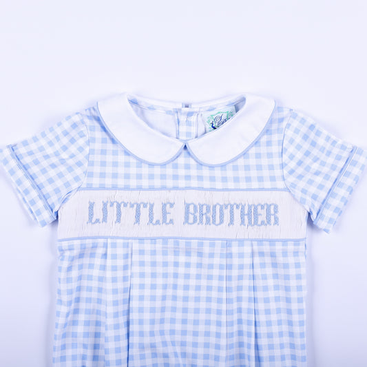 Detailed view of hand-smocked Little Brother embroidery on a light blue gingham baby boy bubble outfit.
