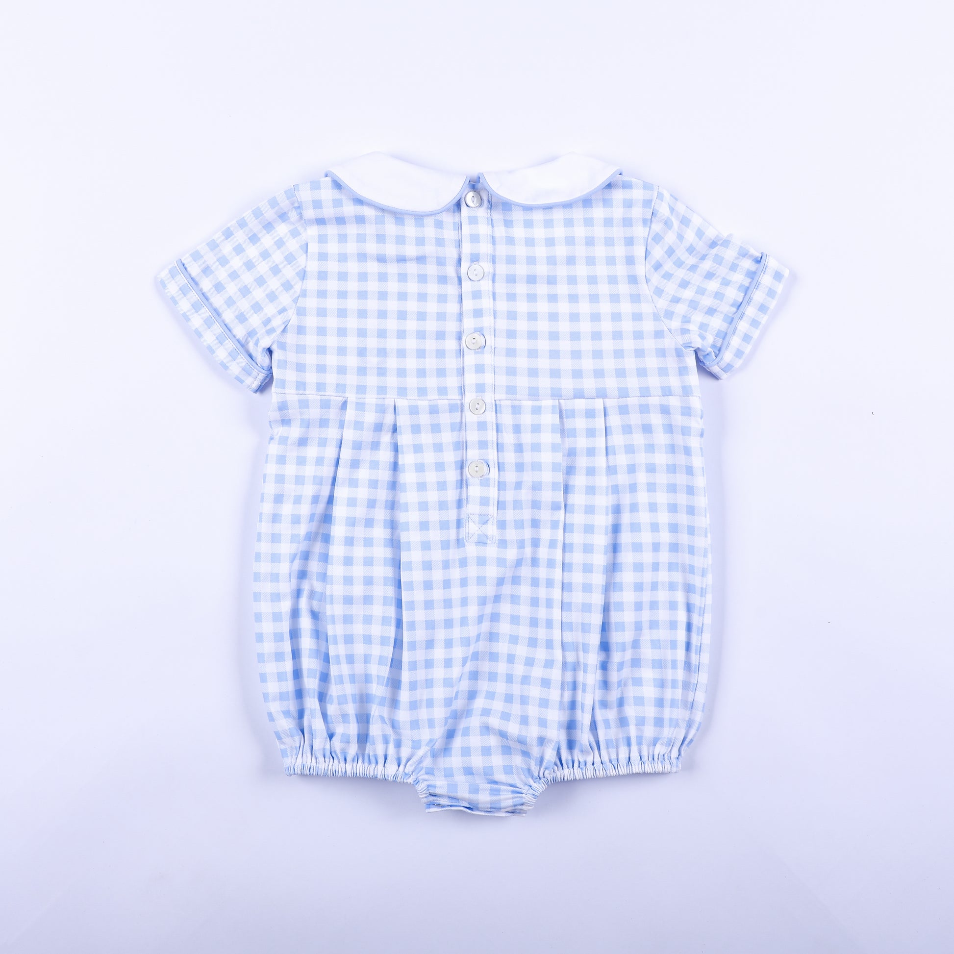 Full back view of light blue gingham smocked baby boy bubble romper featuring classic button closures.