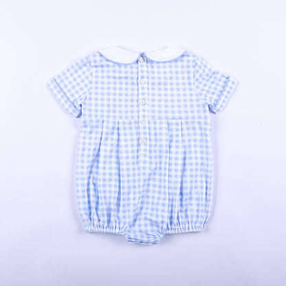 Full back view of light blue gingham smocked baby boy bubble romper featuring classic button closures.