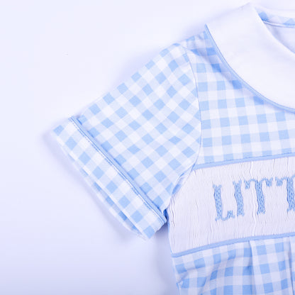 Close-up of the piped short sleeve and detailed smocked chest on a blue gingham Little Brother bubble.