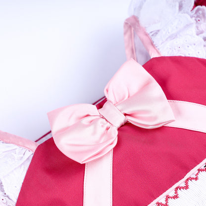 Close up of soft pink satin bow trim on chest of magical sewing mice hand embroidered pink princess dress.