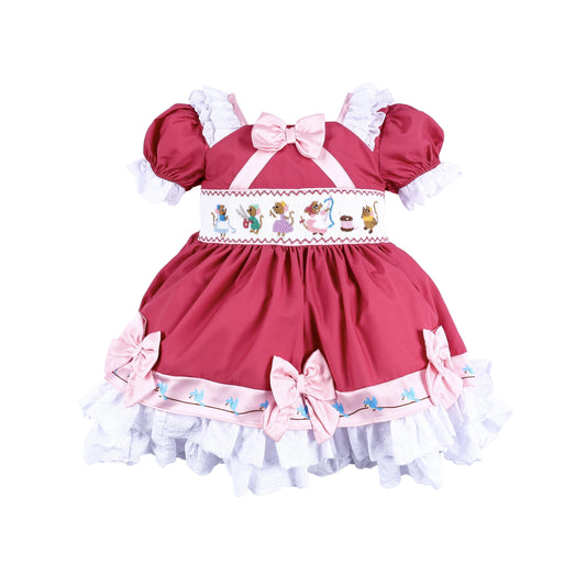 Front view of magical sewing mice smocked pink princess dress with hand embroidery and ruffled lace hem.