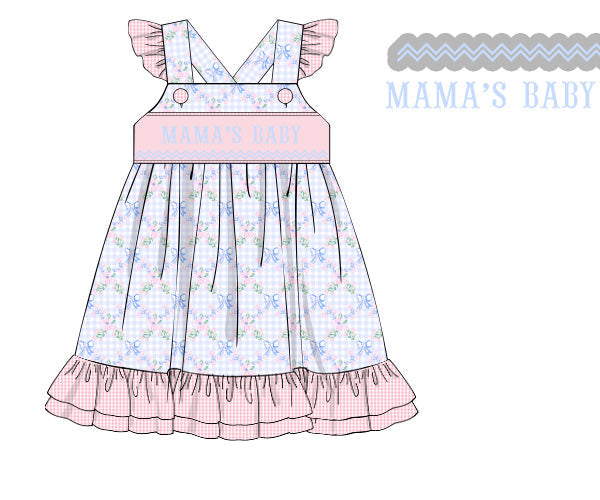 Hand smocked ruffle girls dress in blue floral gingham with pink ruffles and Mama's Baby smocking panel.