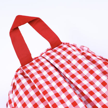 Top angle close-up of sturdy red carrying handle and padded straps on hand-smocked boys Mickey backpack.
