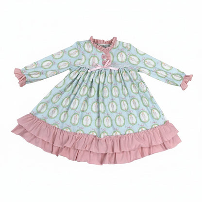Studio flat lay of Nutcracker Ballet aqua blue and pink ruffled nightgown for girls on a white backdrop.