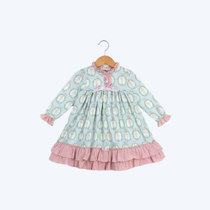 Nutcracker Ballet aqua blue and pink long sleeve nightgown with ruffles displayed on a wooden hanger.