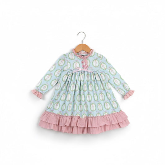 Nutcracker Ballet aqua blue and pink long sleeve nightgown with ruffles displayed on a wooden hanger.