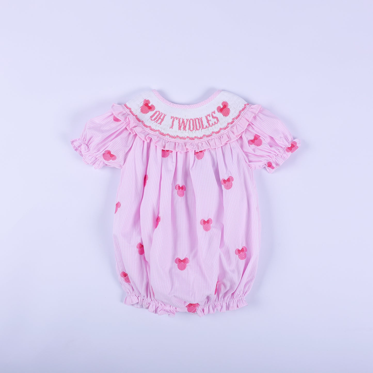Oh Twoodles pink gingham hand smocked bubble romper with hand embroidered mouse details and ruffled sleeves.