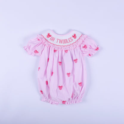 Oh Twoodles pink gingham hand smocked bubble romper with hand embroidered mouse details and ruffled sleeves.
