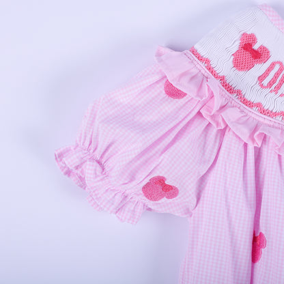 Detailed view of flutter ruffled sleeve on pink gingham smocked baby bubble with hand embroidered mouse accent.