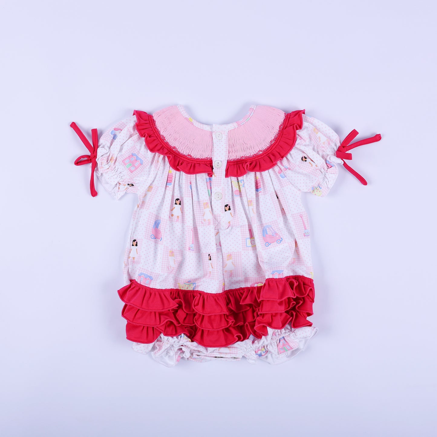 Back view of Dolly & Me pink checkered bubble romper showcasing button closures and layered hot pink bottom ruffles.