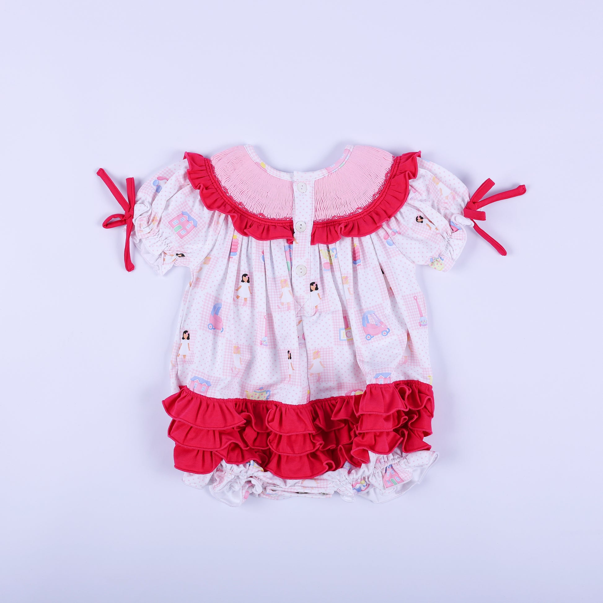 Back view of Dolly & Me pink checkered bubble romper showcasing button closures and layered hot pink bottom ruffles.