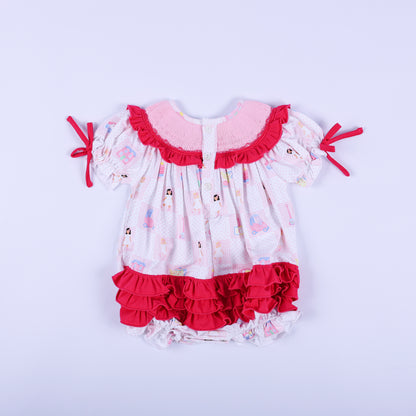 Back view of Dolly & Me pink checkered bubble romper showcasing button closures and layered hot pink bottom ruffles.